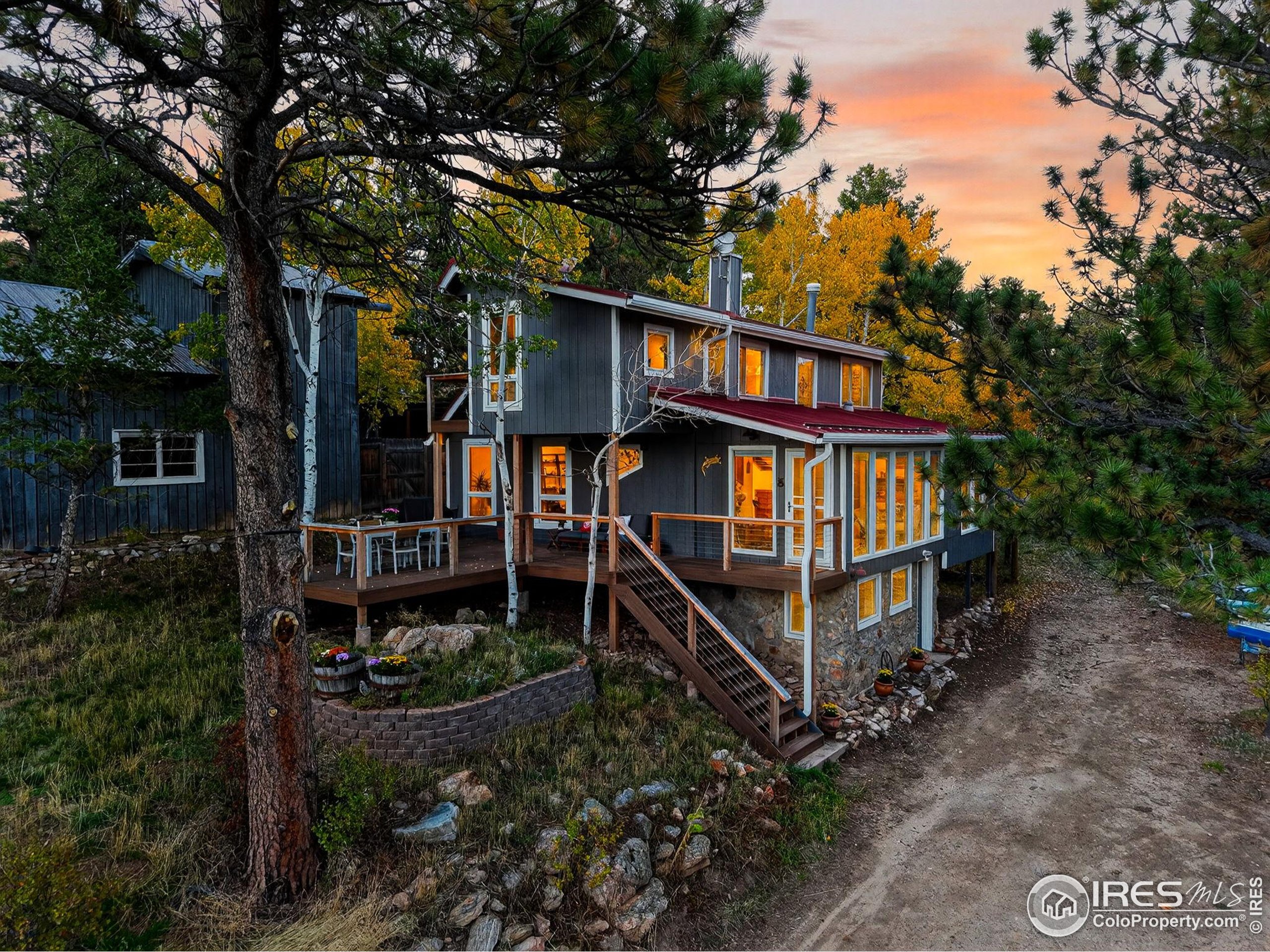 1707 Ridge Road Nederland, CO 80466 - Photo 3 of 50 a view of a house with a yard