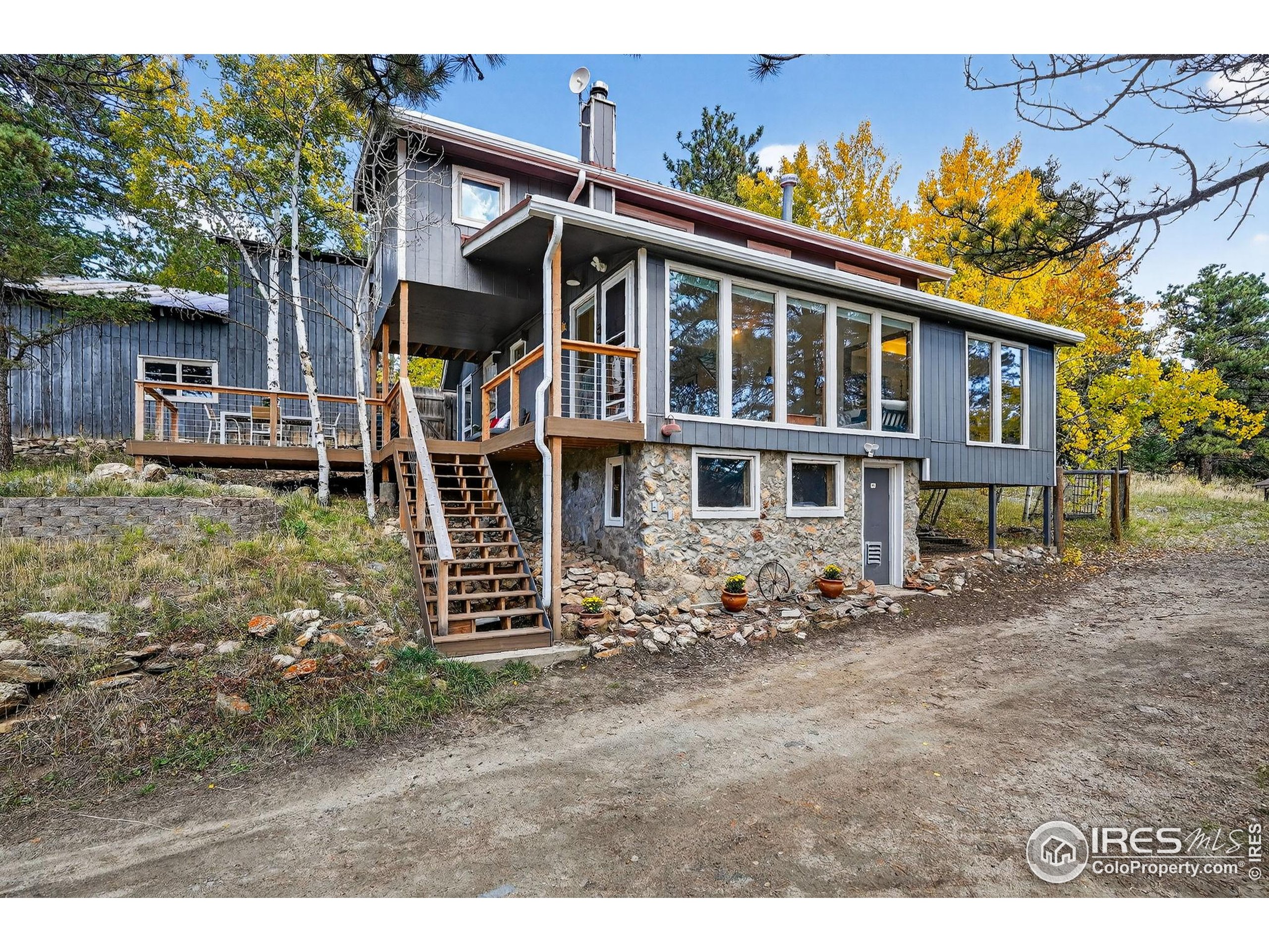 1707 Ridge Road Nederland, CO 80466 - Photo 34 of 50 a view of a house with a yard