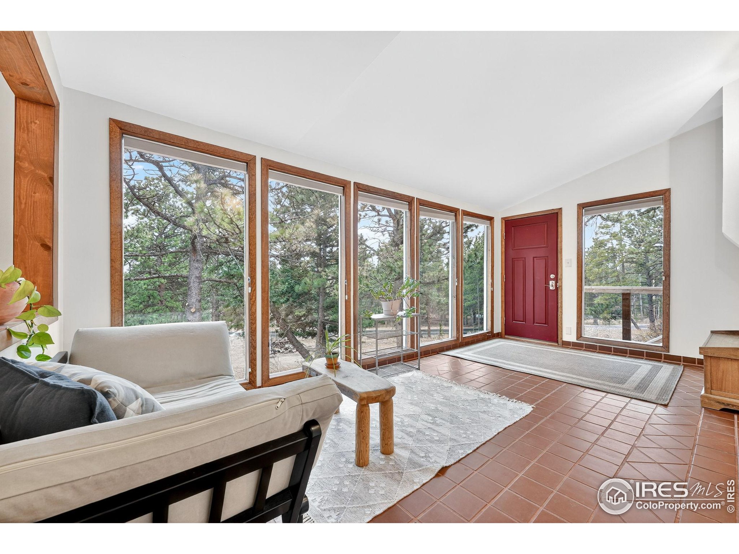1707 Ridge Road Nederland, CO 80466 - Photo 6 of 50 a living room with furniture and a large window