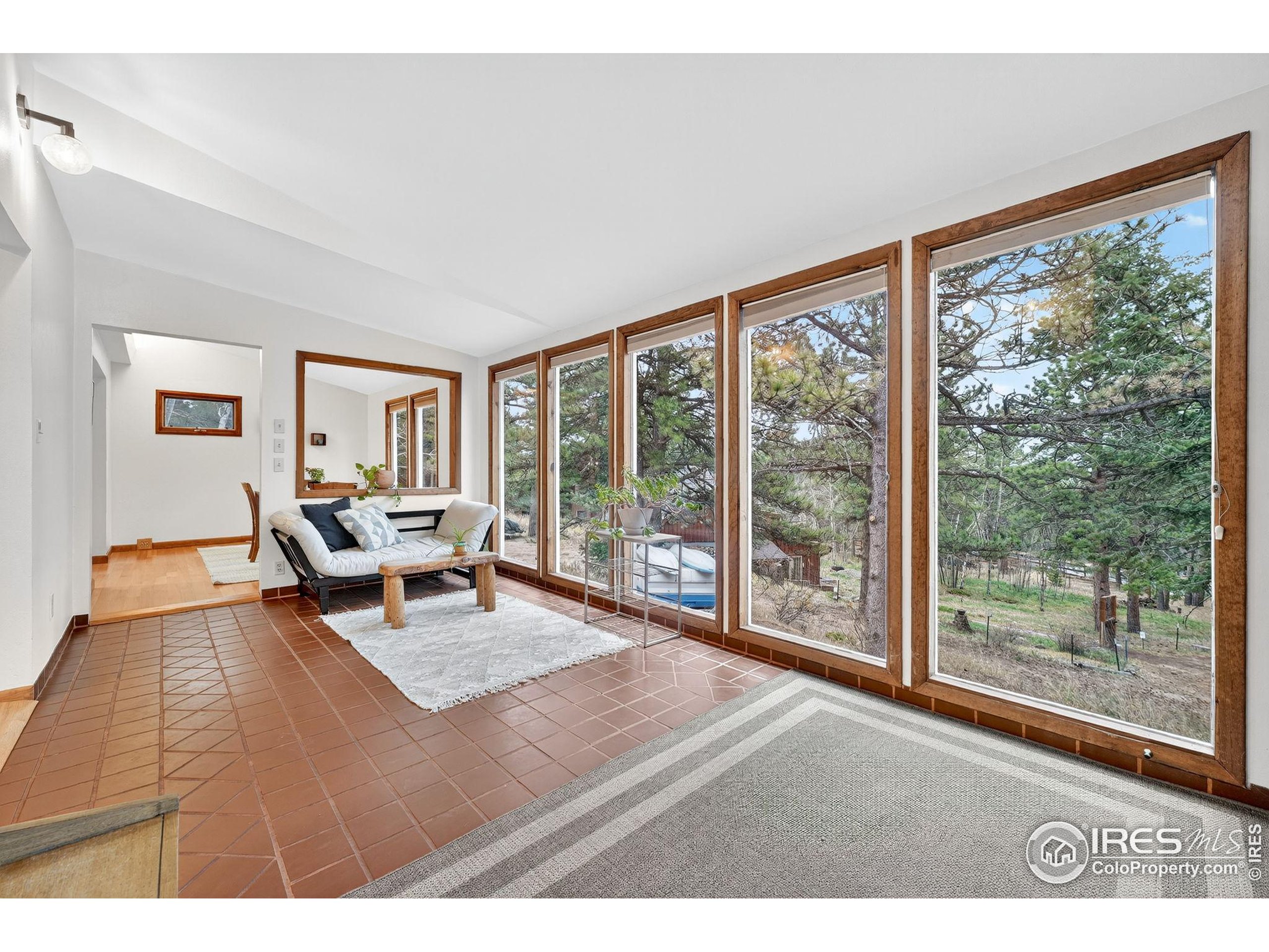 1707 Ridge Road Nederland, CO 80466 - Photo 8 of 50 a living room with furniture and a large window