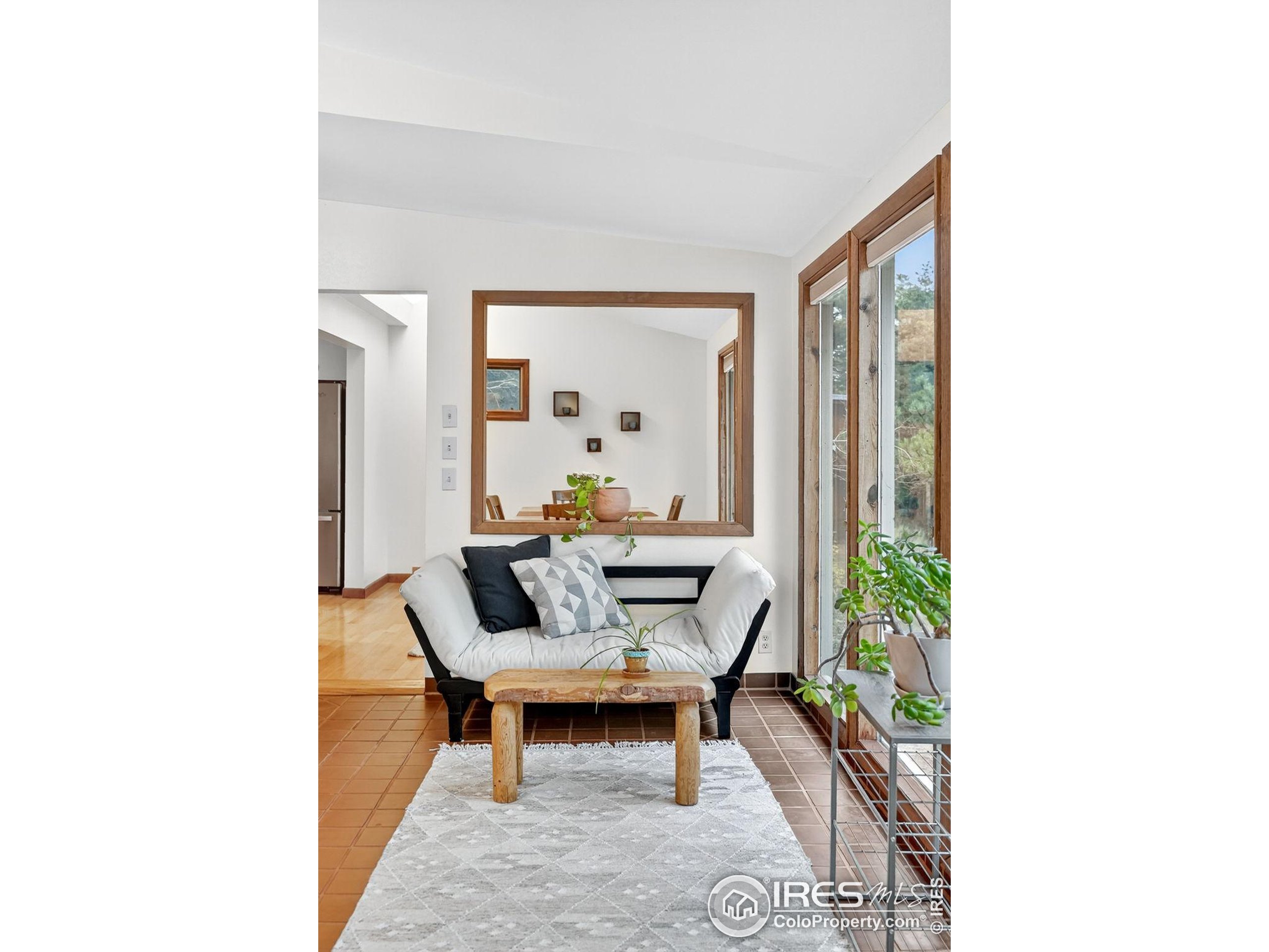 1707 Ridge Road Nederland, CO 80466 - Photo 9 of 50 a living room with furniture and a potted plant