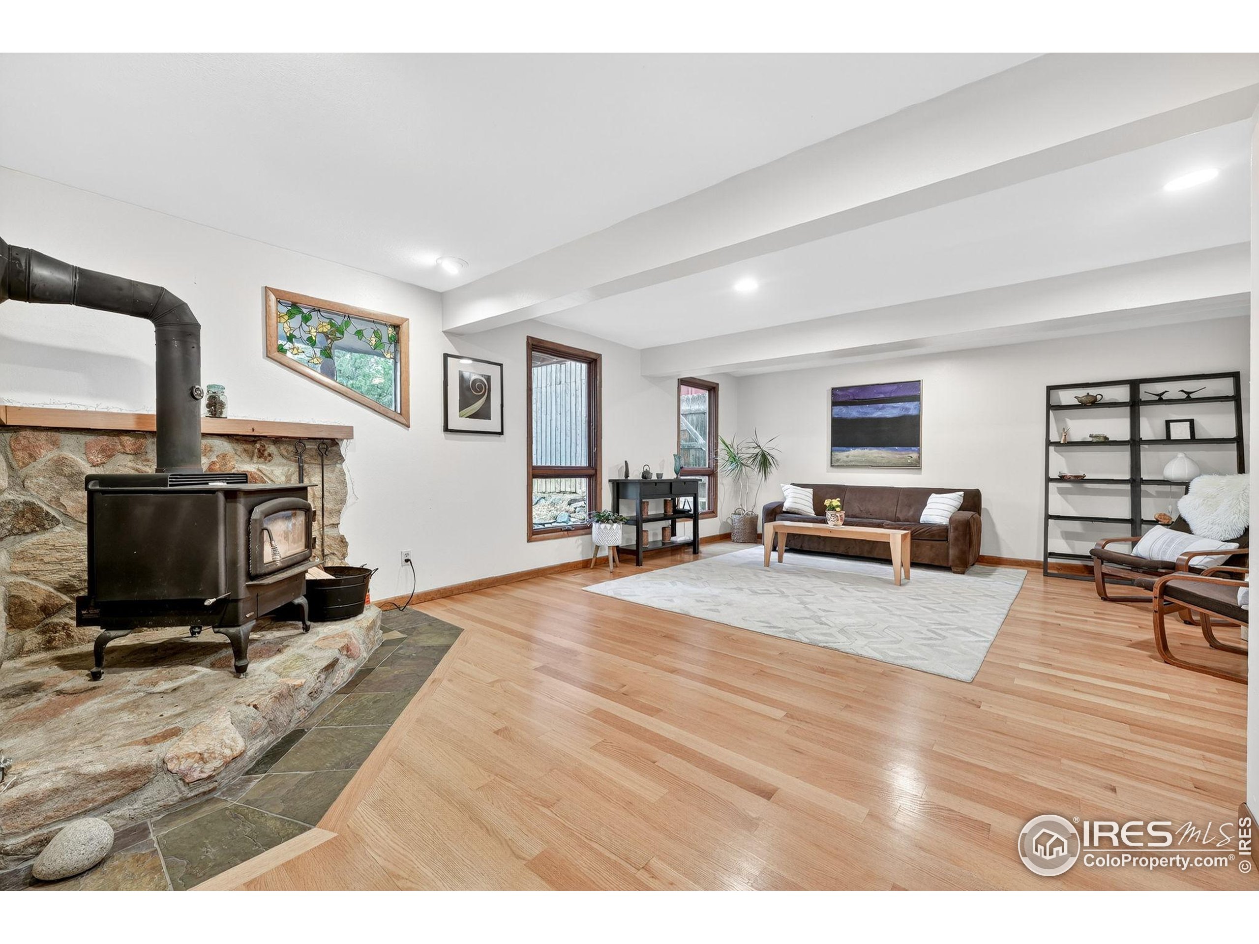 1707 Ridge Road Nederland, CO 80466 - Photo 10 of 50 a living room with furniture and a flat screen tv
