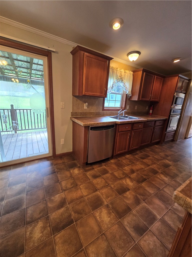 5337 State Rte 26 Triangle, NY 13862 - Photo 5 of 22 Warm wood cabinetry and tile flooring anchor this functional kitchen layout.