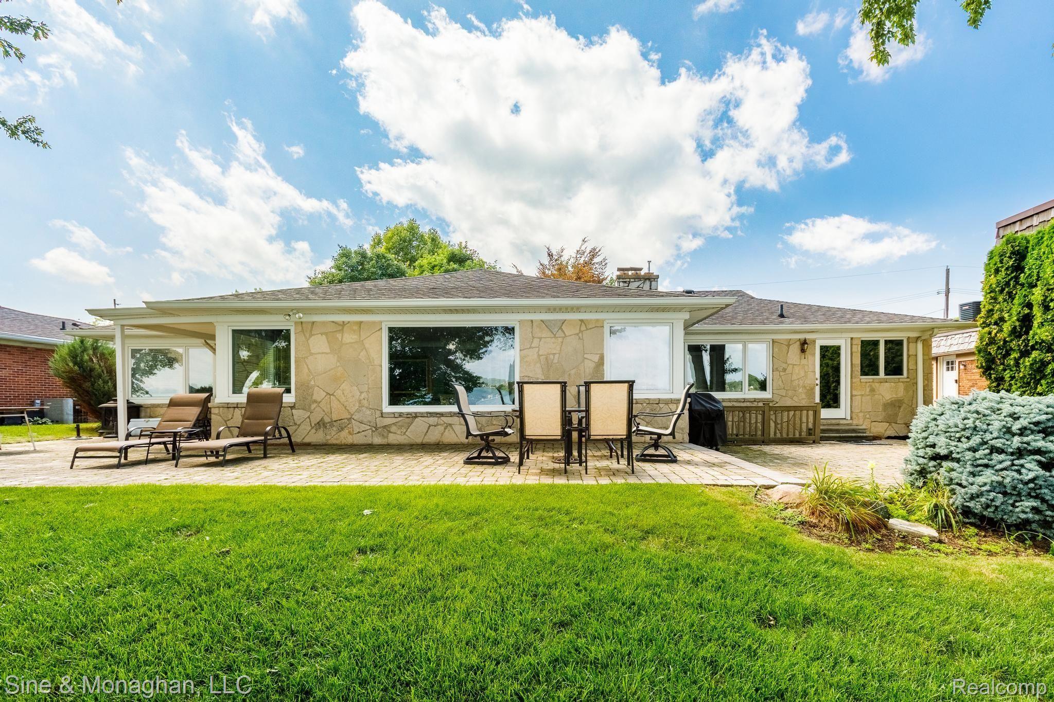 1317 River Road St. Clair, MI 48079 - Photo 38 of 46 38 FRONT OF HOME WITH PATIO 1317 River Rd-37.jpg