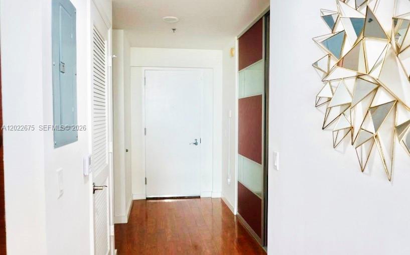 2681 North Flamingo Road, Unit 2602S Sunrise, FL 33323 - Photo 3 of 18 a view of a hallway with paintings on the wall