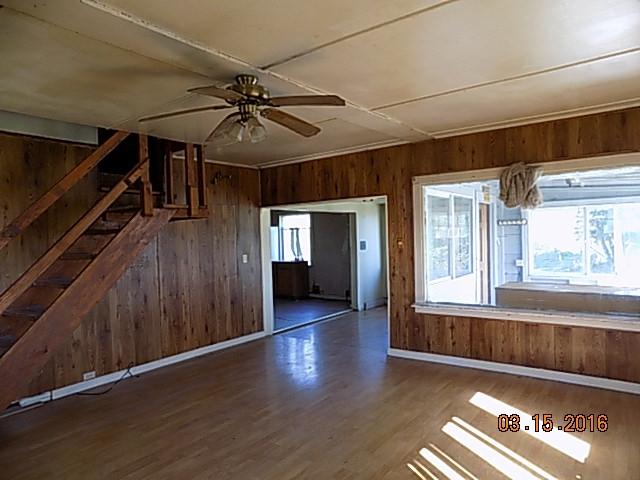 993 Port Kenyon Road Ferndale, CA 95536 - Photo 5 of 26 a view of hallway with wooden floor and stairs