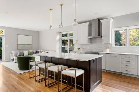 a kitchen with a sink cabinets and window