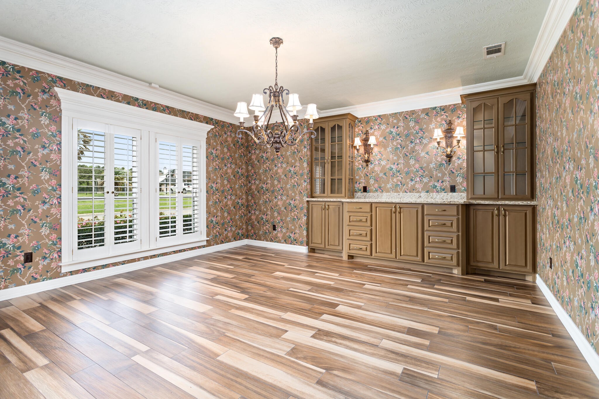 145 Greenhead Point Orange, TX 77630 - Photo 18 of 49 a view of a room with wooden floor windows and a chandelier