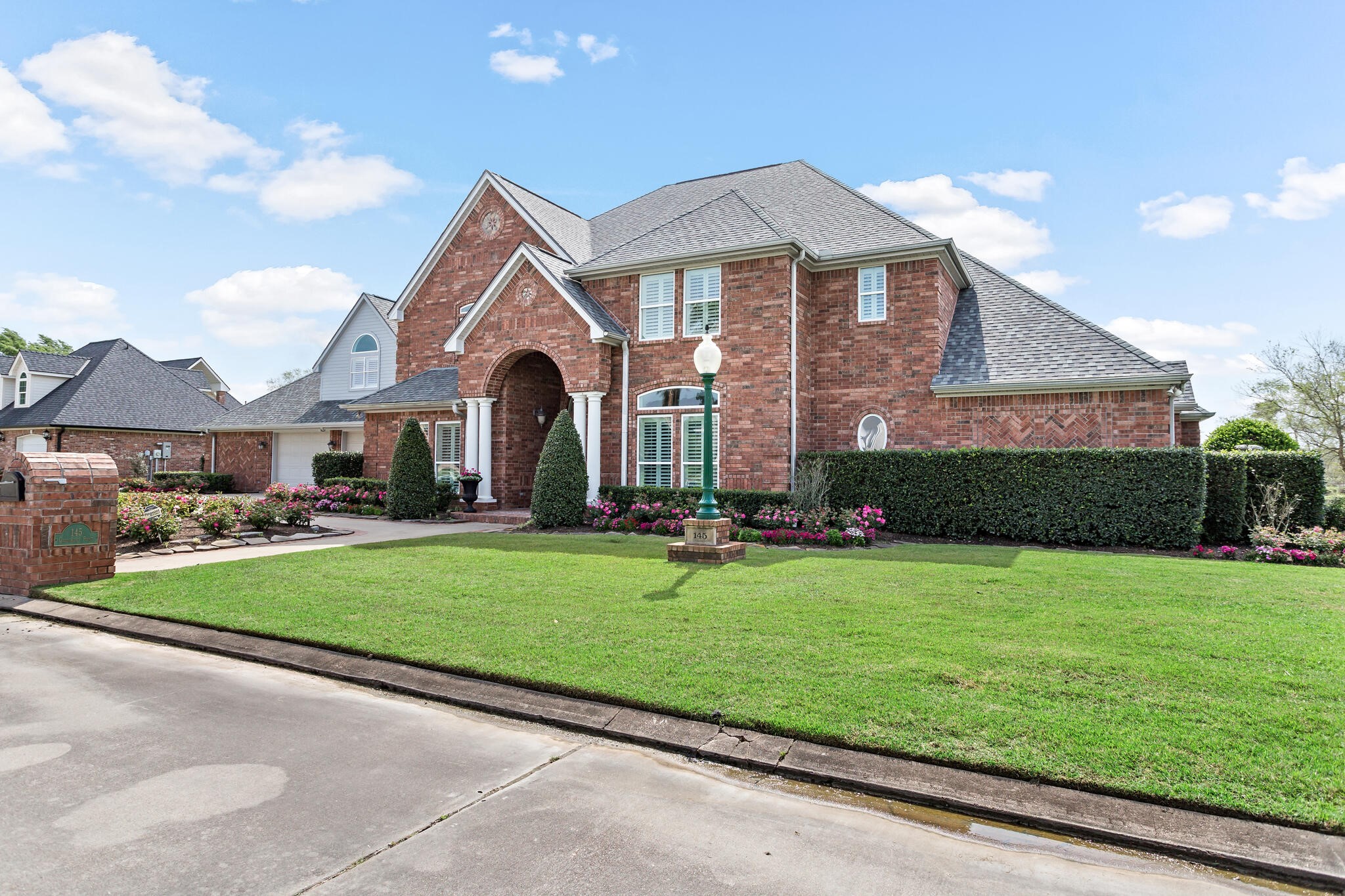 145 Greenhead Point Orange, TX 77630 - Photo 3 of 49 a front view of a house with a yard and garage