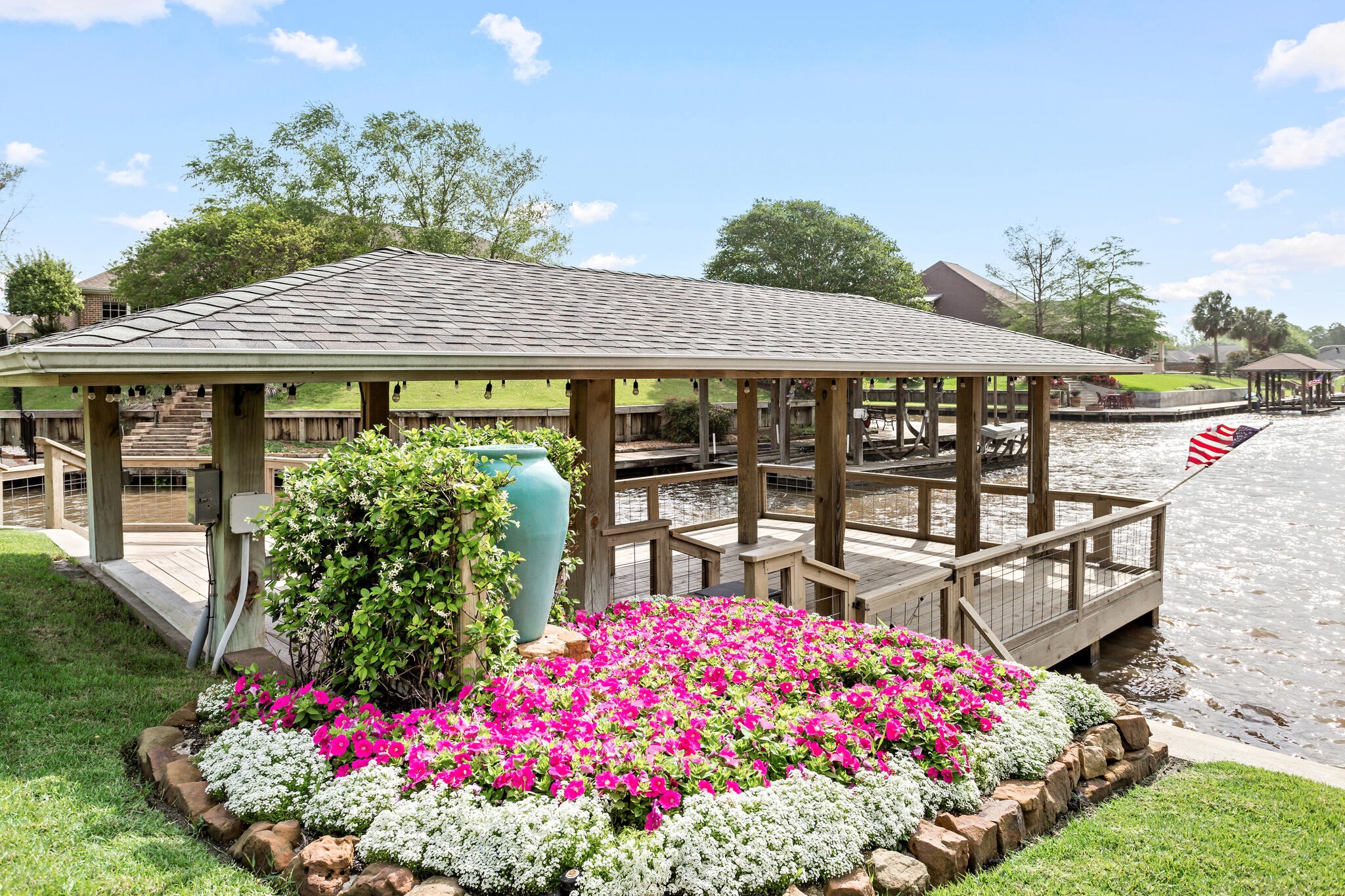 145 Greenhead Point Orange, TX 77630 - Photo 44 of 49 a front view of a house with a big yard and potted plants