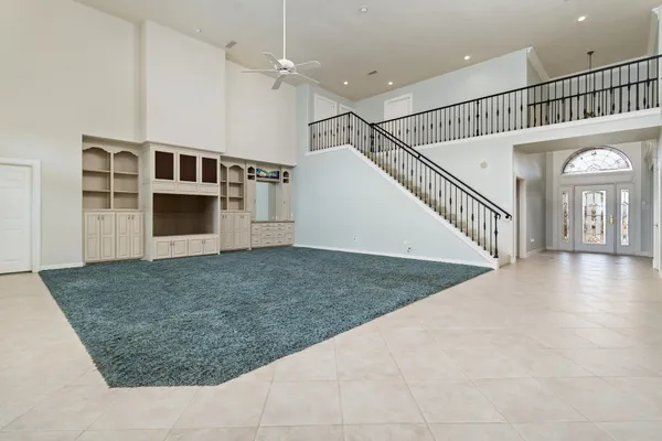 a view of staircase with white walls and windows