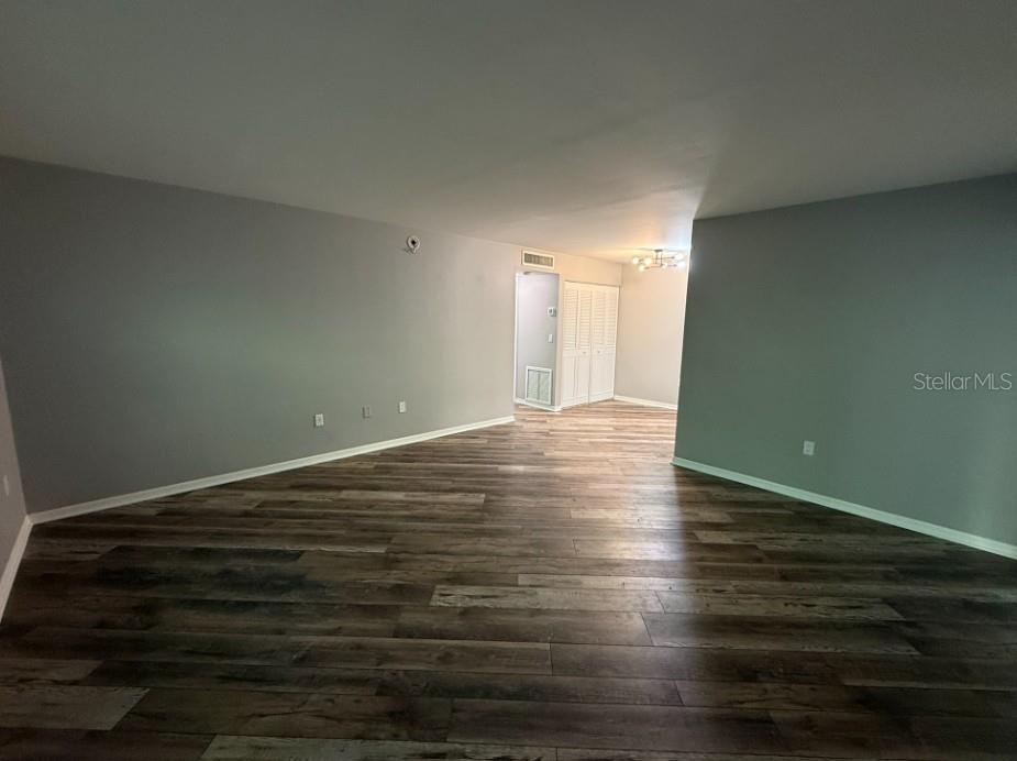5800 Hollywood Boulevard, Unit 324 Sarasota, FL 34231 - Photo 3 of 11 a view of a room with wooden floor