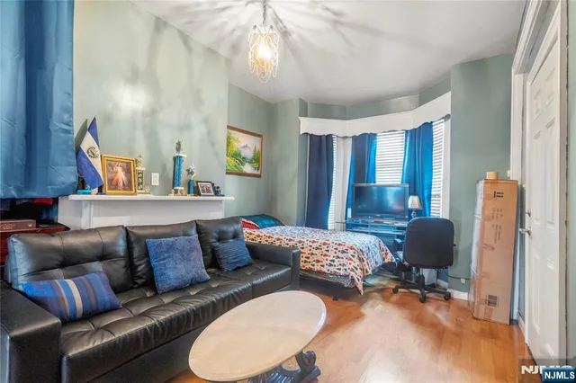 a view of living room with furniture and a flat screen tv