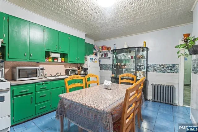 a bathroom with a granite countertop sink and a toilet