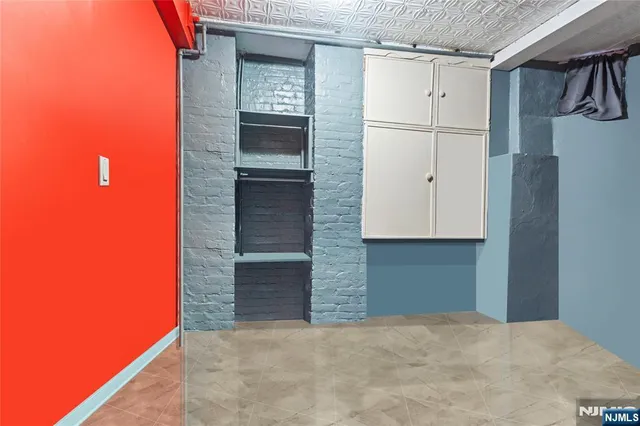 a view of a roof deck with table and chairs with wooden floor and fence