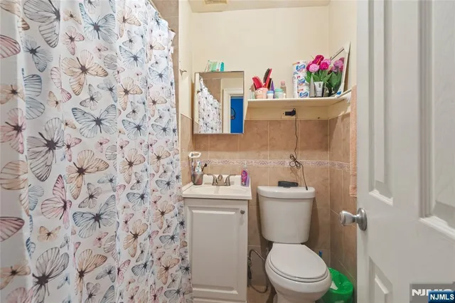 a kitchen with a sink appliances and cabinets