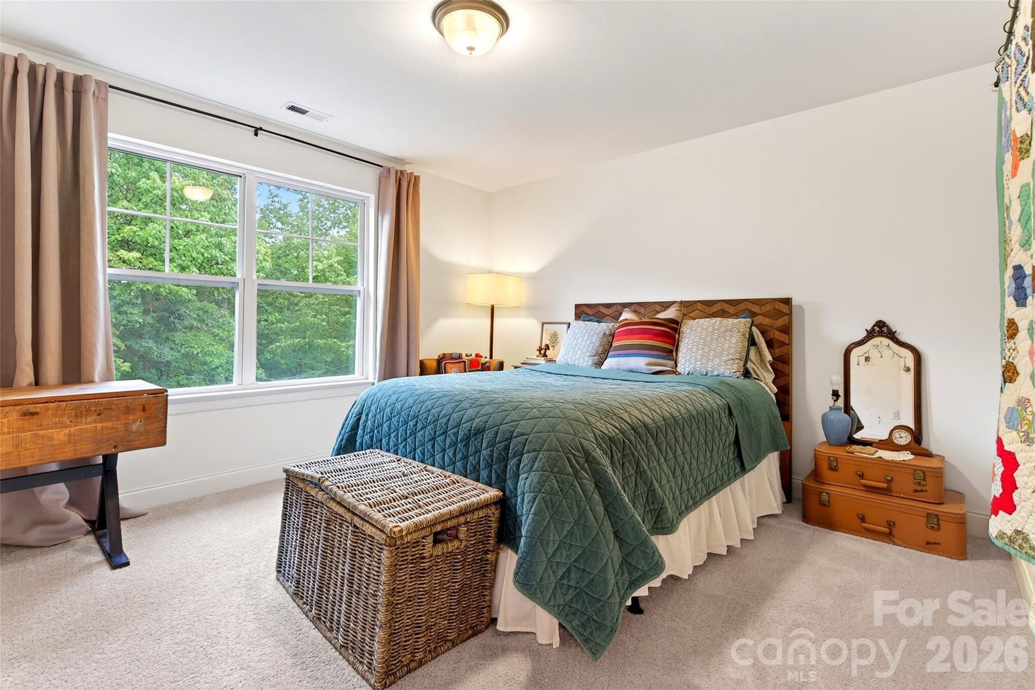 132 Maple Ridge Drive Old Fort, NC 28762 - Photo 31 of 40 a bedroom with a bed and a large window