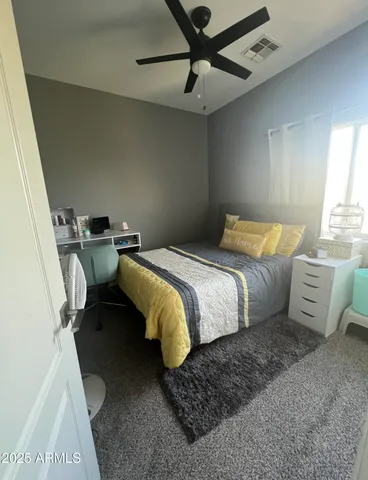 a bedroom with a bed and furniture
