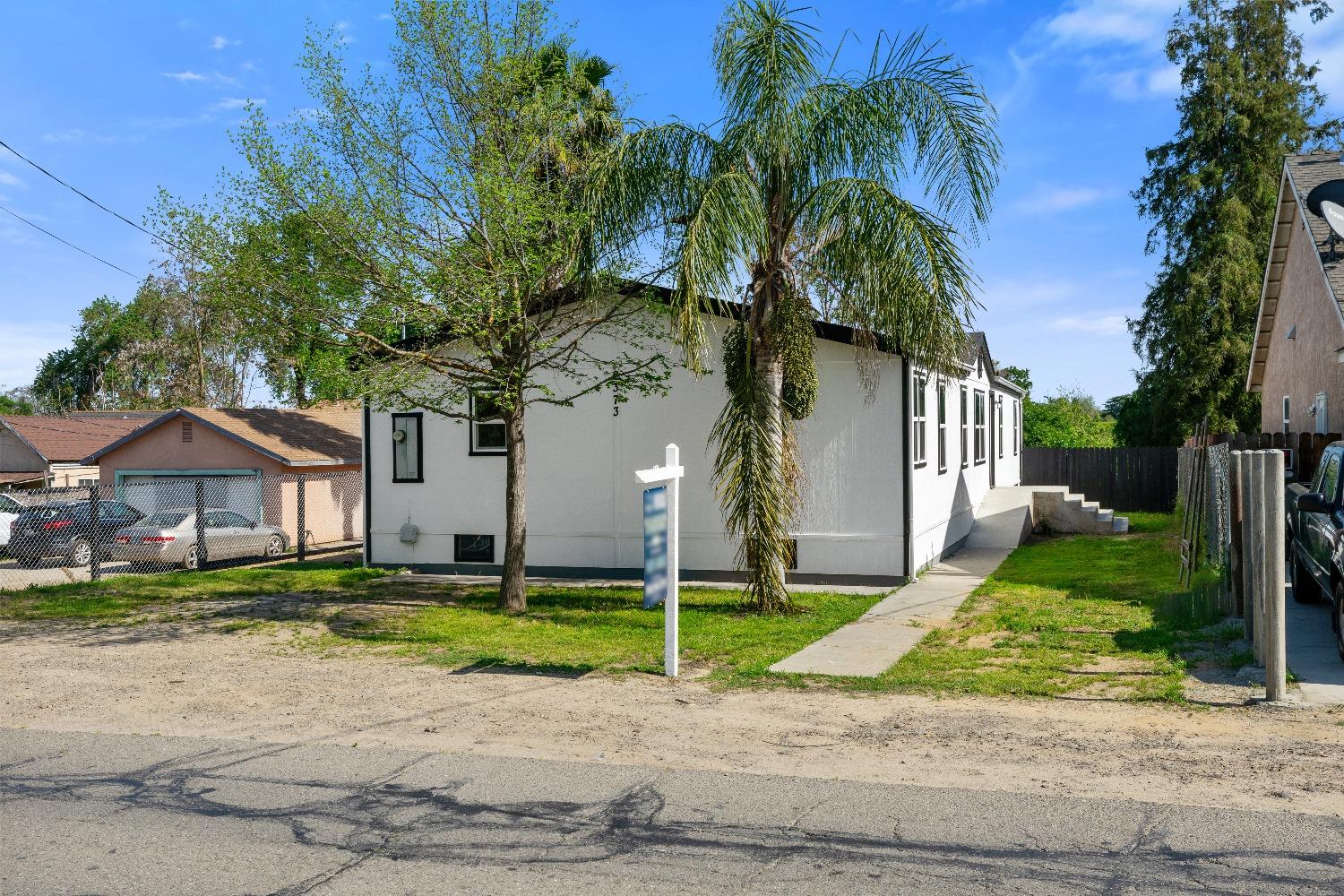 2373 West Hatch Road Modesto, CA 95358 - Photo 1 of 1 a house view with a garden space
