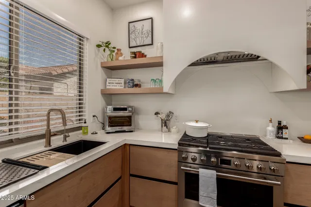 a kitchen with a stove and a microwave