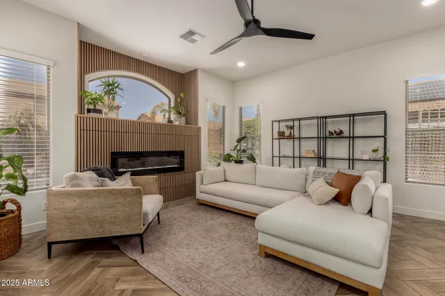 a living room with furniture and a fireplace