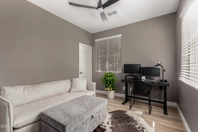 a living room with furniture rug and a window