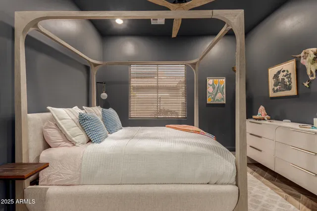 a bedroom with a bed and a walk in closet