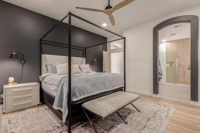 a bedroom with a balcony a bed and a couch