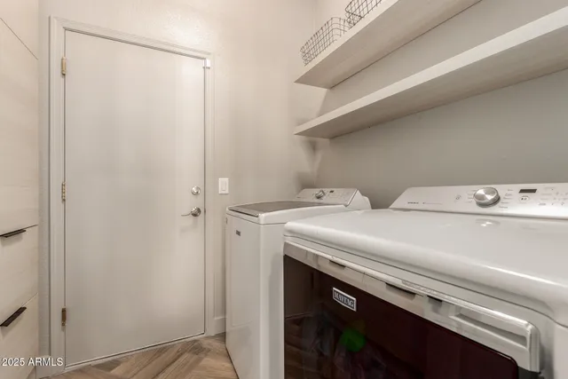 a view of a porch with furniture and a fire pit