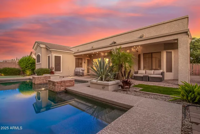 a front view of house with yard and outdoor seating