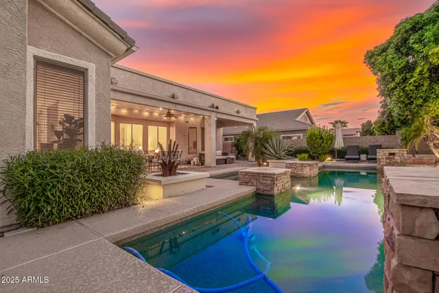 a view of a swimming pool with a patio