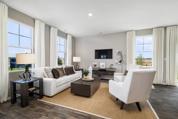 a living room with fireplace furniture and a flat screen tv