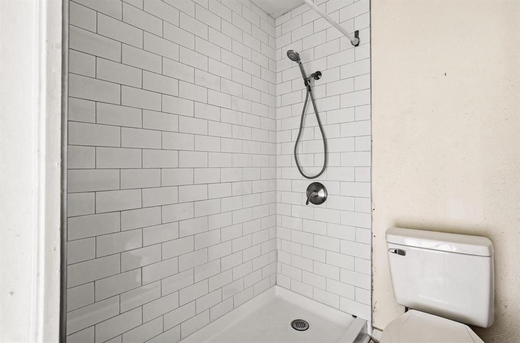 421 East Hull Street Denison, TX 75021 - Photo 14 of 33 a bathroom with a shower