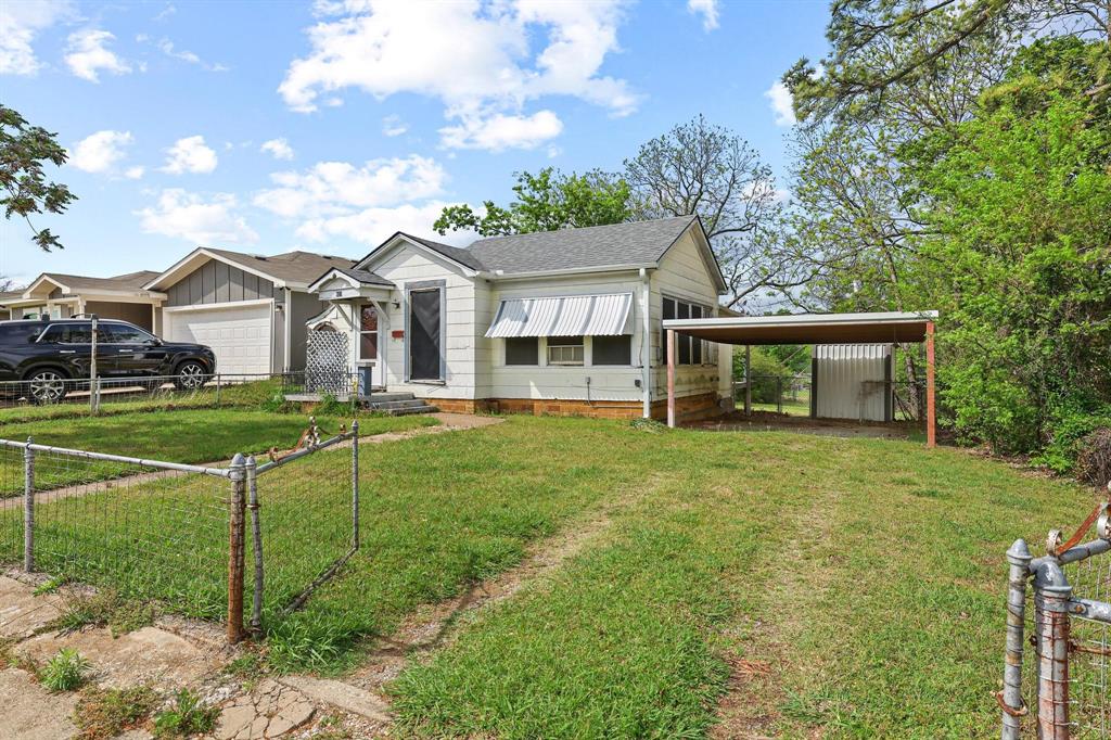 421 East Hull Street Denison, TX 75021 - Photo 2 of 33 a view of a house with a backyard