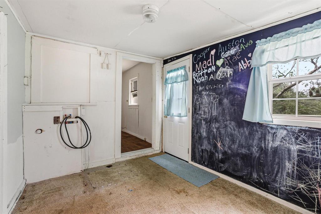 421 East Hull Street Denison, TX 75021 - Photo 25 of 33 a bathroom with a granite countertop sink and a mirror