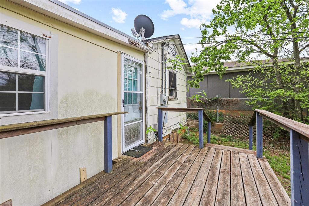 421 East Hull Street Denison, TX 75021 - Photo 27 of 33 a balcony view with two chairs and wooden floor