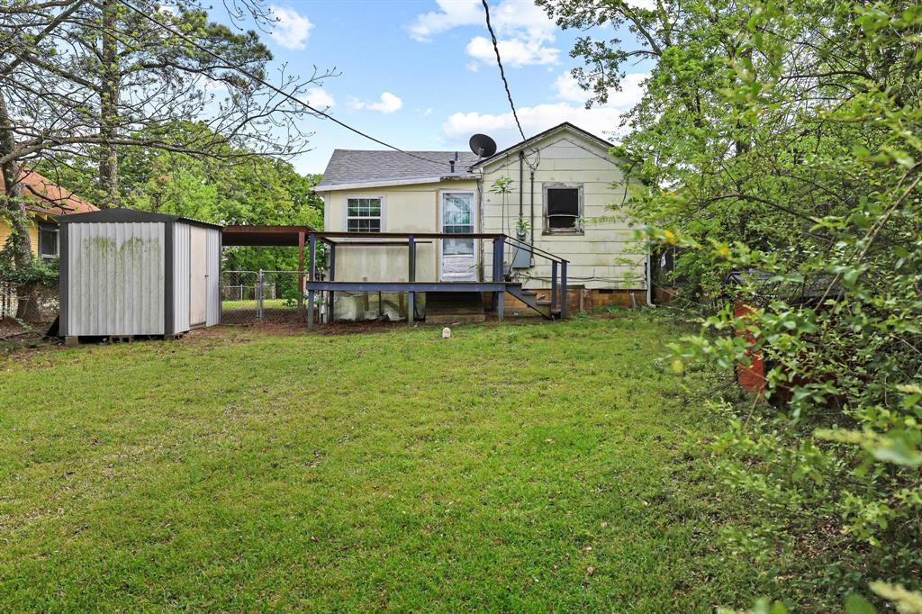 421 East Hull Street Denison, TX 75021 - Photo 28 of 33 a view of a house with a yard and sitting area