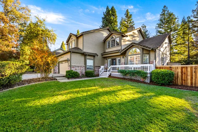 a front view of a house with swimming pool