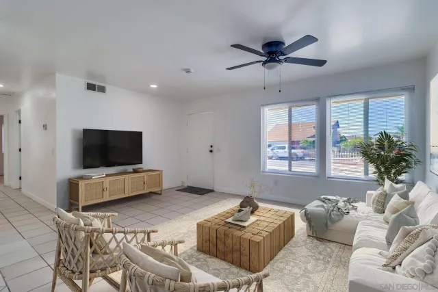a living room with furniture and a flat screen tv