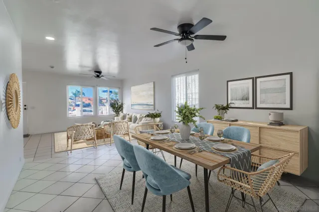 a view of a dining room with furniture and a chandelier