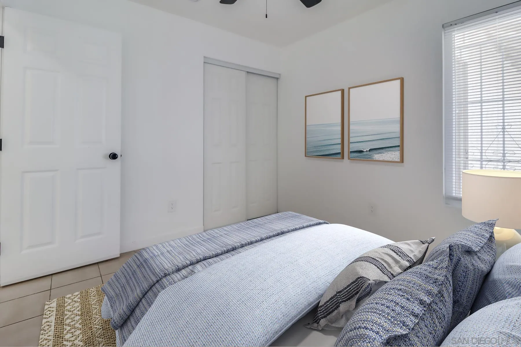 2165 Valentino Street San Diego, CA 92154 - Photo 6 of 11 a bedroom with a bed and a window