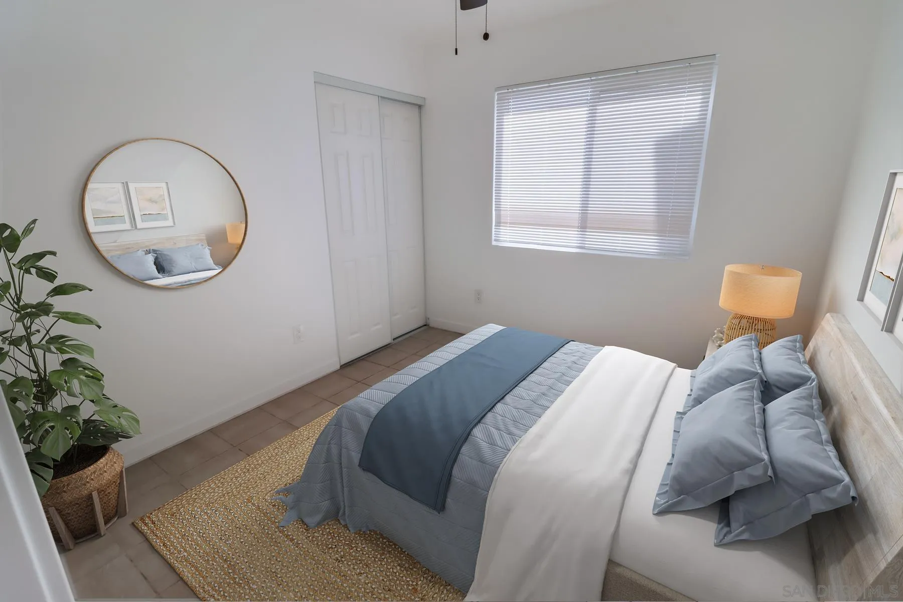 2165 Valentino Street San Diego, CA 92154 - Photo 7 of 11 a bed sitting in a bedroom next to a window