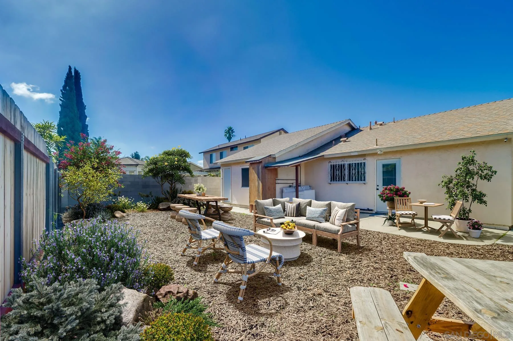 2165 Valentino Street San Diego, CA 92154 - Photo 10 of 11 a backyard of a house with outdoor seating