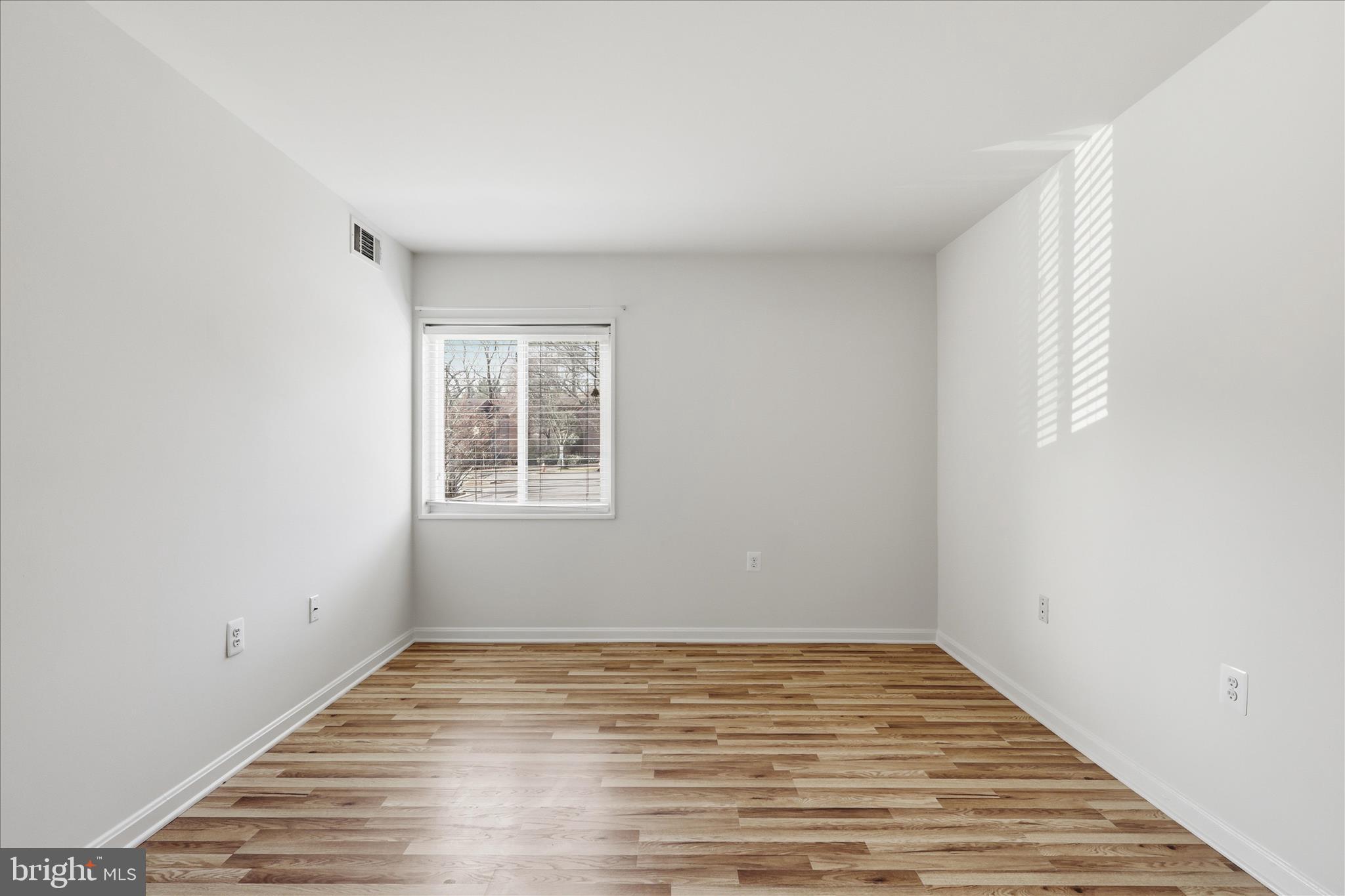 1433 Northgate Square, Unit 11B Reston, VA 20190 - Photo 17 of 44 a view of empty room with wooden floor and fan