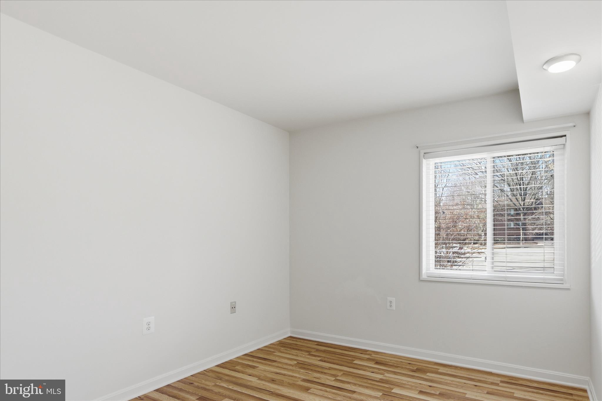 1433 Northgate Square, Unit 11B Reston, VA 20190 - Photo 20 of 44 a view of a room with wooden floor and windows