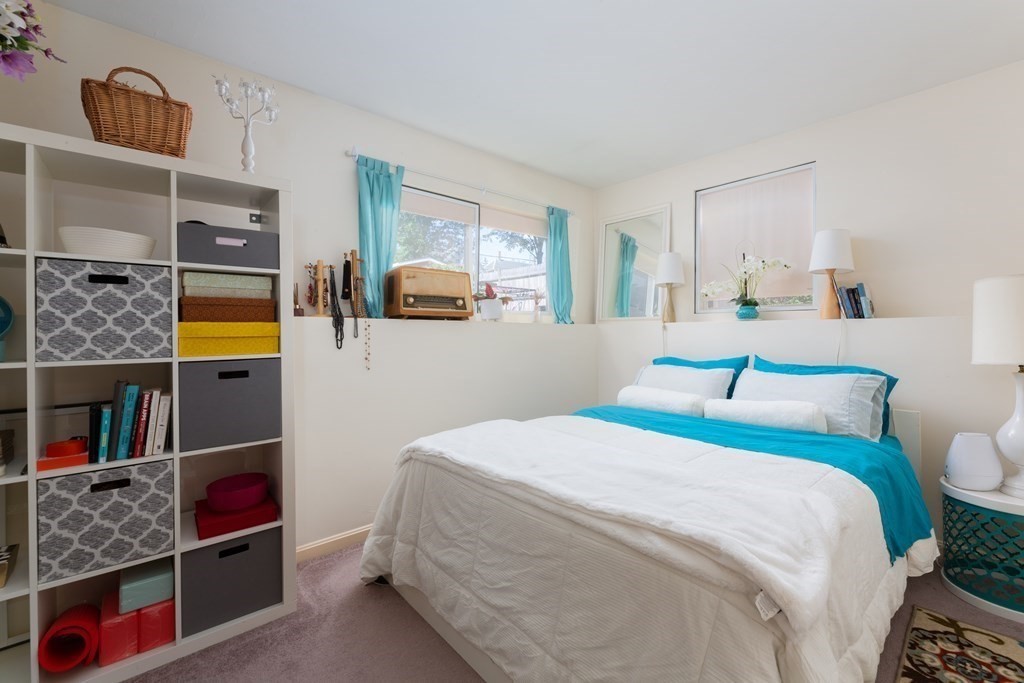 33 Forest Street Boston, MA 02119 - Photo 12 of 23 a bedroom with a bed and a window