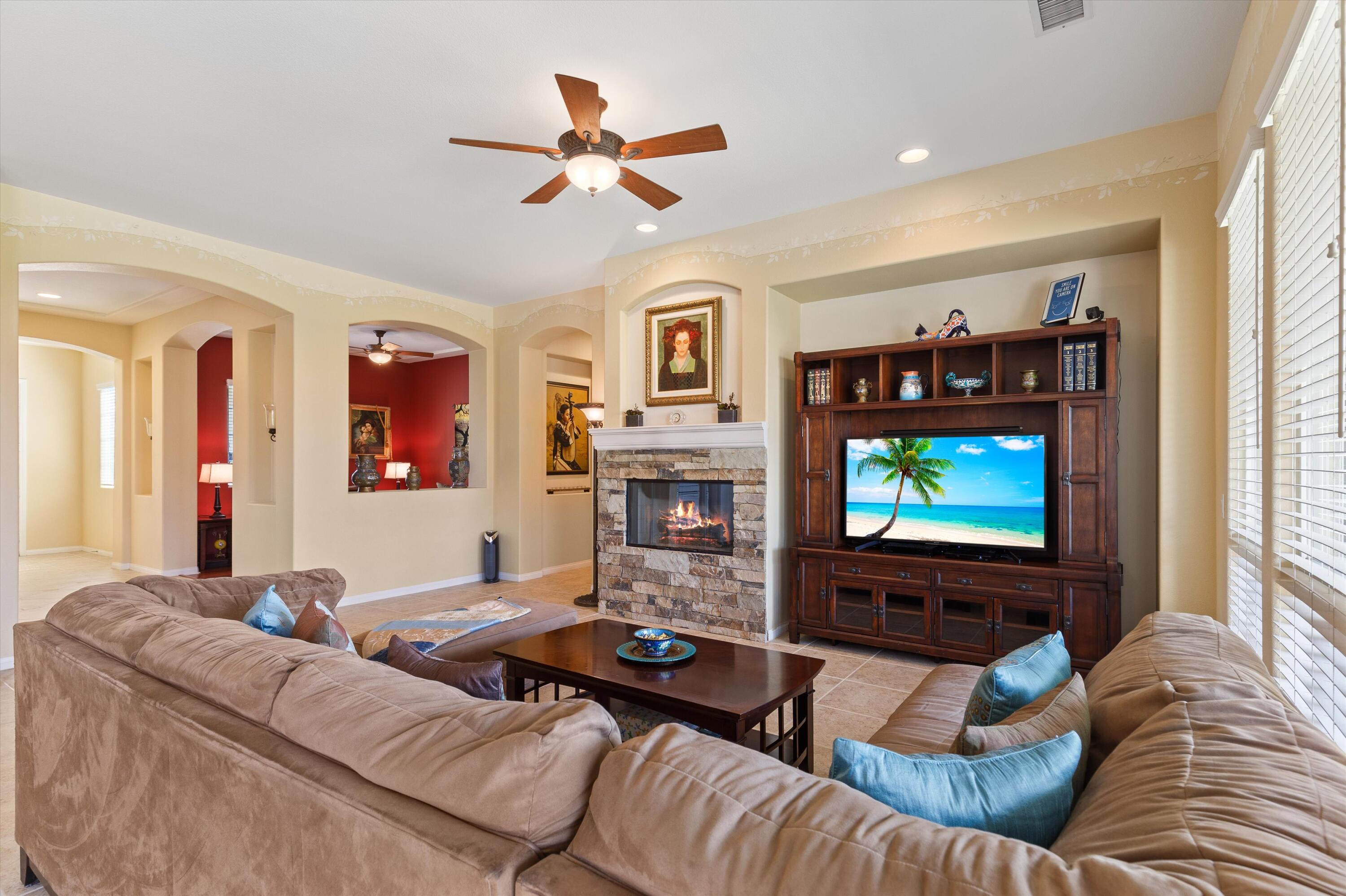27 Via Del Maricale Rancho Mirage, CA 92270 - Photo 11 of 52 a living room with furniture and a flat screen tv