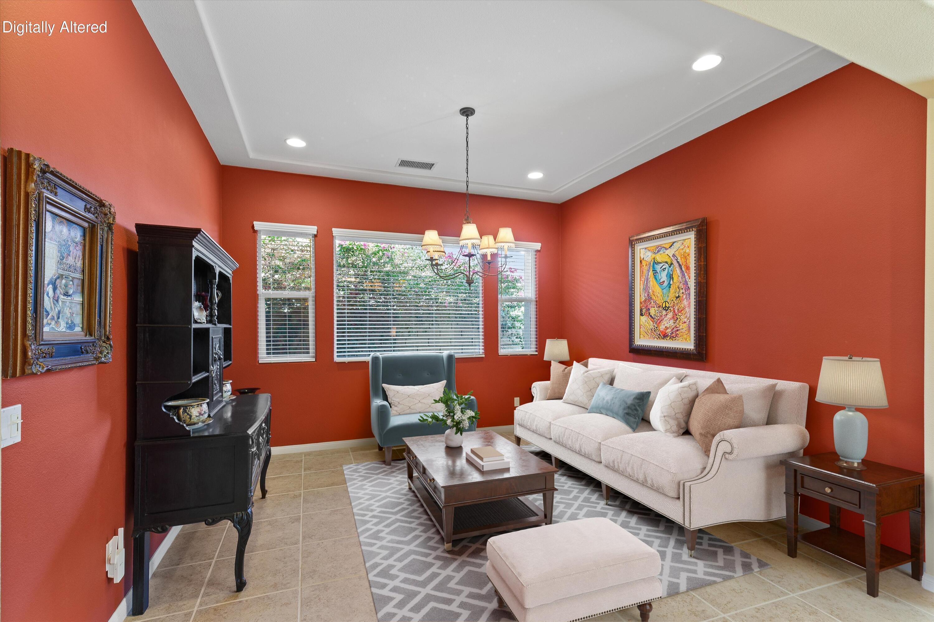 27 Via Del Maricale Rancho Mirage, CA 92270 - Photo 12 of 52 a living room with furniture a large window and a flat screen tv