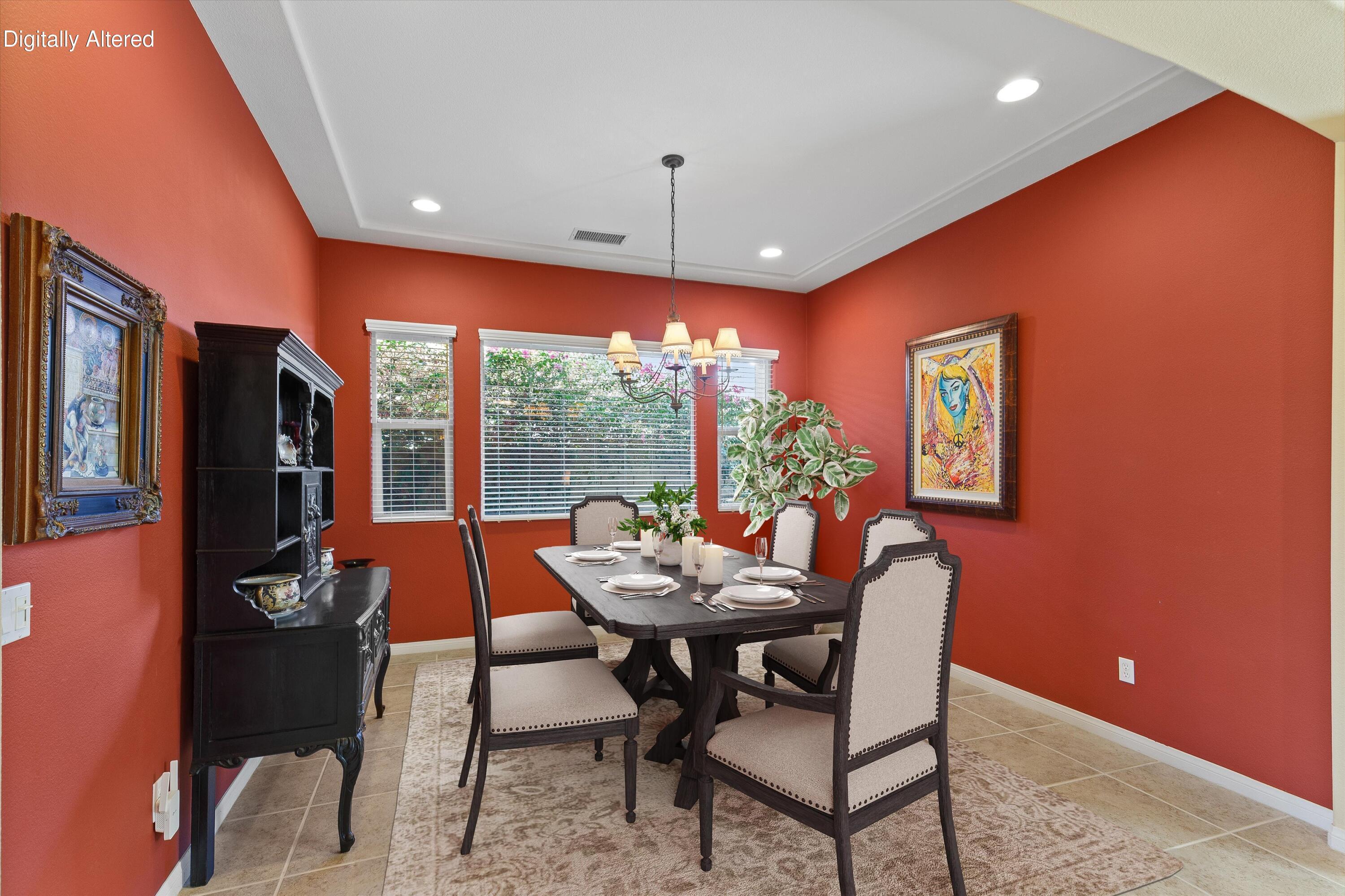 27 Via Del Maricale Rancho Mirage, CA 92270 - Photo 14 of 52 a dining room with furniture and a floor to ceiling window