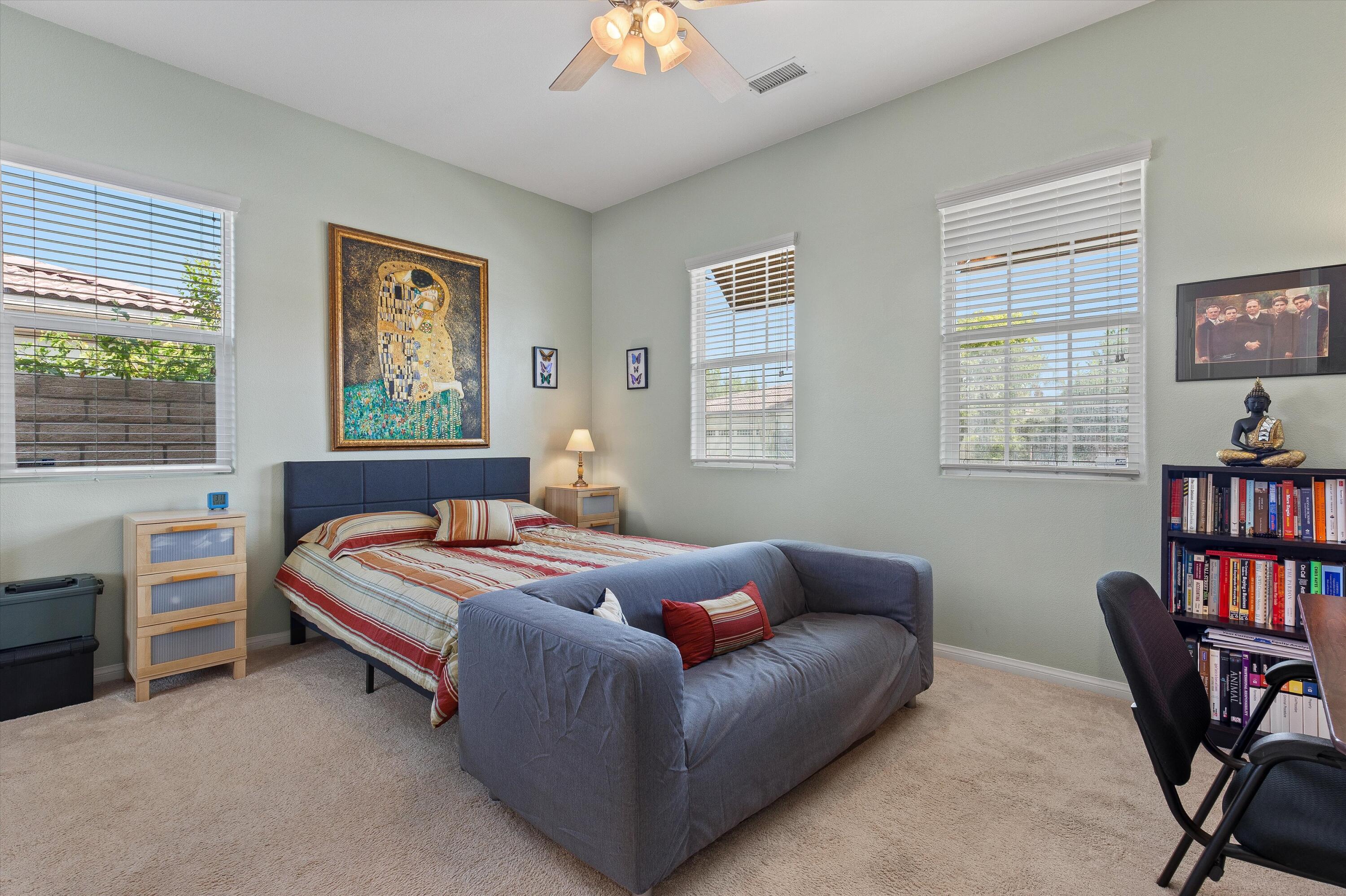 27 Via Del Maricale Rancho Mirage, CA 92270 - Photo 18 of 52 a bedroom with furniture and a window